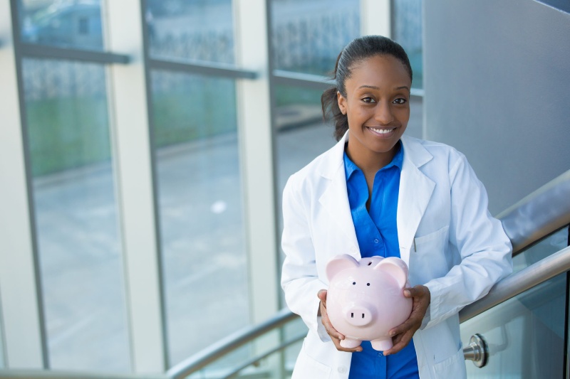 The women dentist with savings pig toy at Hawthorne, CA