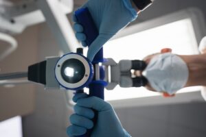 dentist holding machine looking down