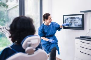 dentist showing patient their xray on a screen